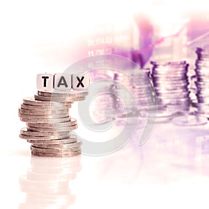 TAX word cube on the silver coins stcking