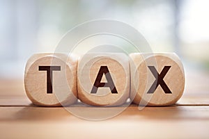 Tax written in wooden block letters