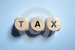 Tax written in wooden block letters