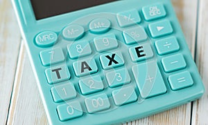 Taxe White Background Text on Calculator Buttons Business Concept.