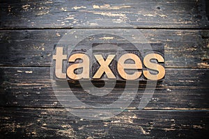 Taxes Concept Vintage Wooden Letterpress Type Word