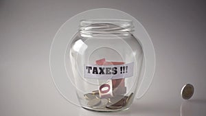 Taxes, money savings in a jar