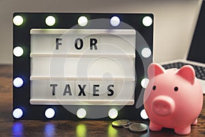 For taxes phrase written on marquee lightbox - savings for tax concept