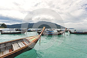 taxi boat floating on calm crystal clear water