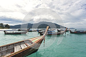 Taxi boat floating on calm crystal clear water