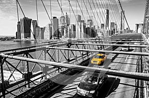 Taxi cab crossing the Brooklyn Bridge in New York photo