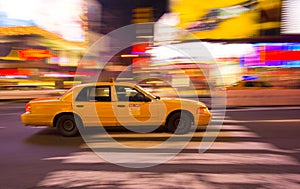 Taxi cab speeding through city