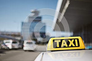 Taxi car against airport terminal