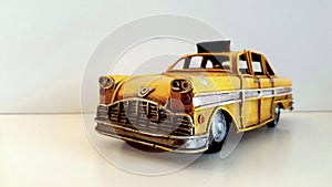Taxi car. Vintage yellow and iron pattern model.