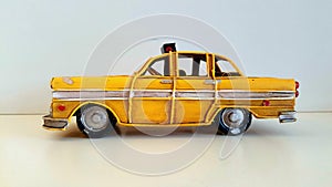 Taxi car. Vintage yellow and iron pattern model.