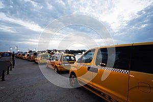 Taxi in the city. Yellow taxis in the city at sunset Nessebar, Bulgaria