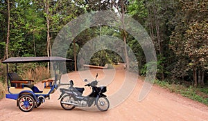 Taxi on dirt road in Cambodia