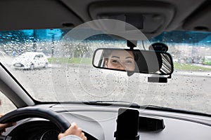 Taxi driver looks at passenger and communicates with client