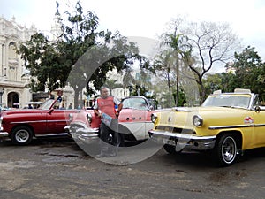 TAXI DRIVER AND VINTAGE AMERICAN CARS, HAVANA, CUBA