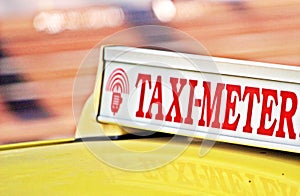 Taxi meter sign on car roof