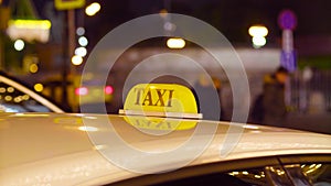 Taxi in Moscow on the blurred lights background