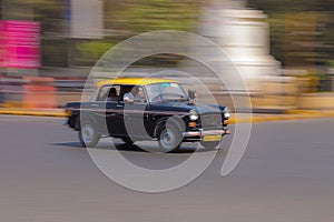Taxi in Mumbai photographed in motion unsharpness photo