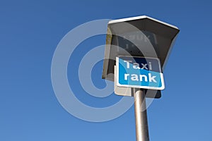 Taxi Rank sign on a tall metal pole