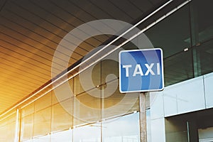 Taxi road sign near airport or mall entrance