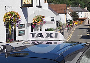 taxi sign on car