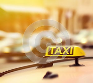 Taxi sign on car in motion blur