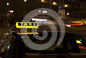 Taxi sign at night