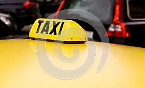 Taxi sign yellow