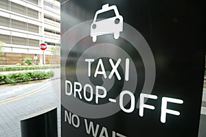 taxi stand sign on black in singapore