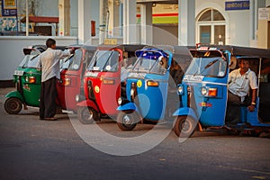 Taxi tuk-tuk with drivers drivers waiting for passengers