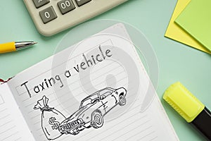 Taxing a vehicle is shown on the photo using the text