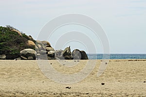 Tayrona National Park surrounded by turquoise sea and white sand beach in Colombia