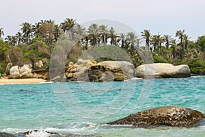 Tayrona National Park surrounded by turquoise sea and white sand beach in Colombia