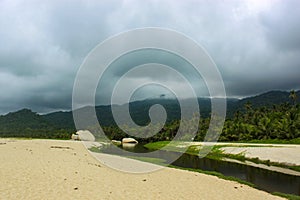 Tayrona National Park surrounded by turquoise sea and white sand beach in Colombia