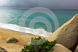 Tayrona National Park surrounded by turquoise sea and white sand beach in Colombia
