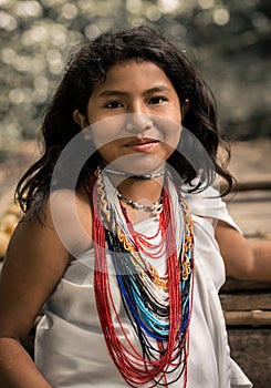 Tayrona, Santa Marta, Colombia - March 09 2021: portrait of an Kogi indigenous kid boy, Kogi child in the Parque Natural Tayrona,