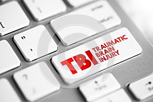 TBI Traumatic Brain Injury - intracranial injury to the brain caused by an external force, acronym text concept button on keyboard