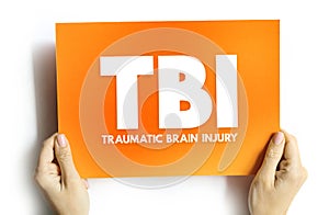 TBI Traumatic Brain Injury - intracranial injury to the brain caused by an external force, acronym text concept on card for