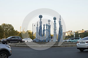 Tbilisi, Georgia - 18 April, 2024: The nine-figure Statue of Clocks near Galaktion Tabidze Bridge