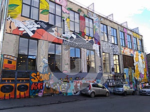 TBILISI, GEORGIA - December 8 2018: The modern design of the courtyard of the urban art zone Fabrika with graffiti