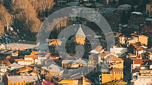 Tbilisi, Georgia. Elevated top Scenic View Of old Churches, city traffic. Urban Cityscape. Evening Scenic View Of City