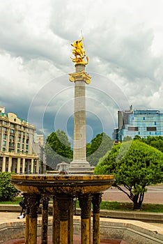 TBILISI, GEORGIA: Liberty Monument Depicting St George Slaying The Dragon And Tbilisi City Hall In Freedom Square