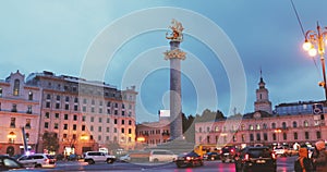 Tbilisi, Georgia. Liberty Monument Depicting St George Slaying Dragon And Tbilisi City Hall In Freedom Square In City