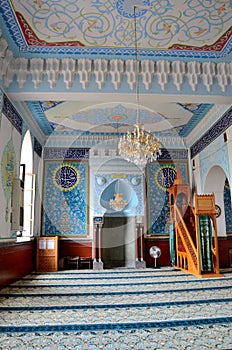 Interior prayer area with blue calligraphy mihrab columns Jumah Central Mosque Tbilisi Georgia photo