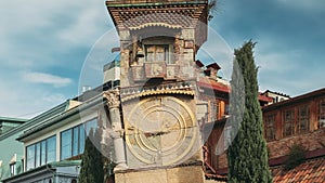 Tbilisi, Georgia. People Walking Near Famous Rezo Gabriadze Marionette Theater Clock Tower On Old City. Puppet Theater