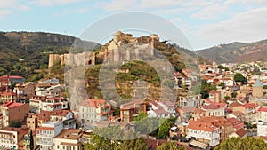Tbilisi old town buildings and Narikala fortress landmark on hill.Sightseeing in Georgia concept