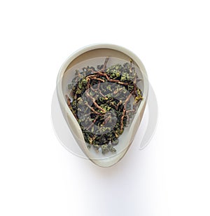 Te Guan Yin mao cha Green Tea, Oolong tea from cuts in the cha he isolated on a white background, top view photo
