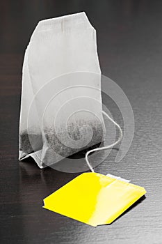 Tea bag with yellow label