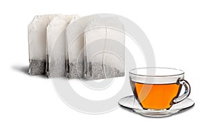 tea bags and tea in a glass cup