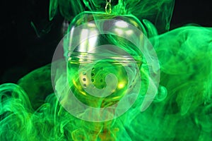 A tea ball with fluorescein in water