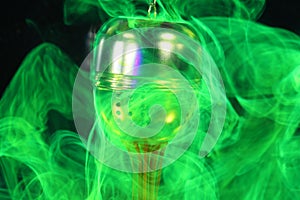 A tea ball with fluorescein in water